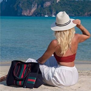 Large black neoprene tote with red and green stripes